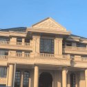 包头黄金麻别墅外墙干挂石材效果示例